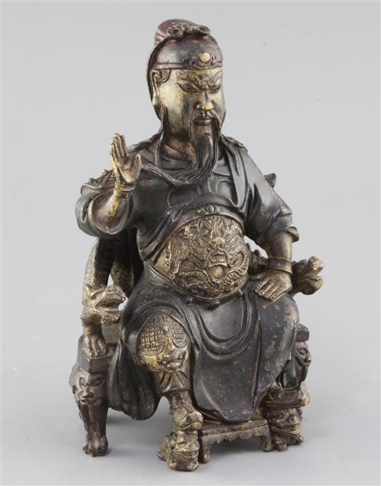 A Chinese polychrome decorated bronze seated figure of Guandi, probably Ming dynasty, height 21.5cm
